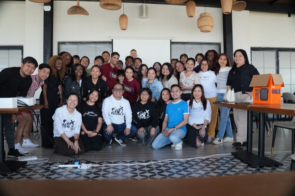 The Koinonia group posing together for a group photo indoors